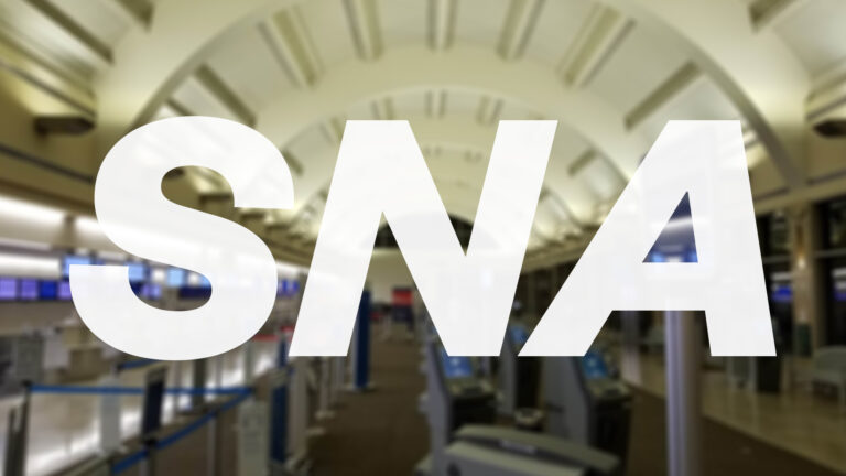 Inside the terminal at John Wayne airport in Orange County with its iconic curved roof.