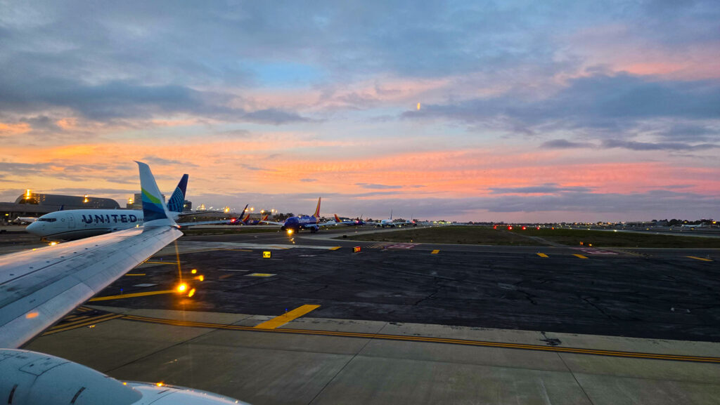 Looking at the taxiway at John Wayne Airport during the sunrise.