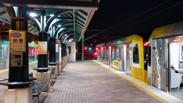 Light rail train waiting for passenger at the platform.